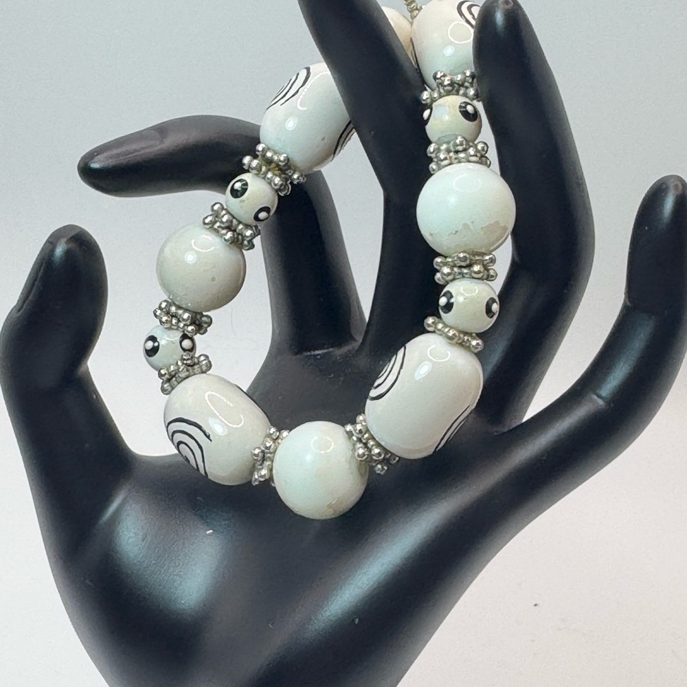 White and Black Beaded Bracelet with Silver Accents